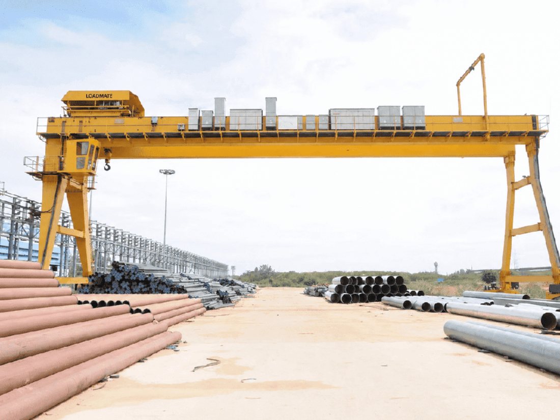 LOADMATE goliath gantry crane over an outdoor pipe yard